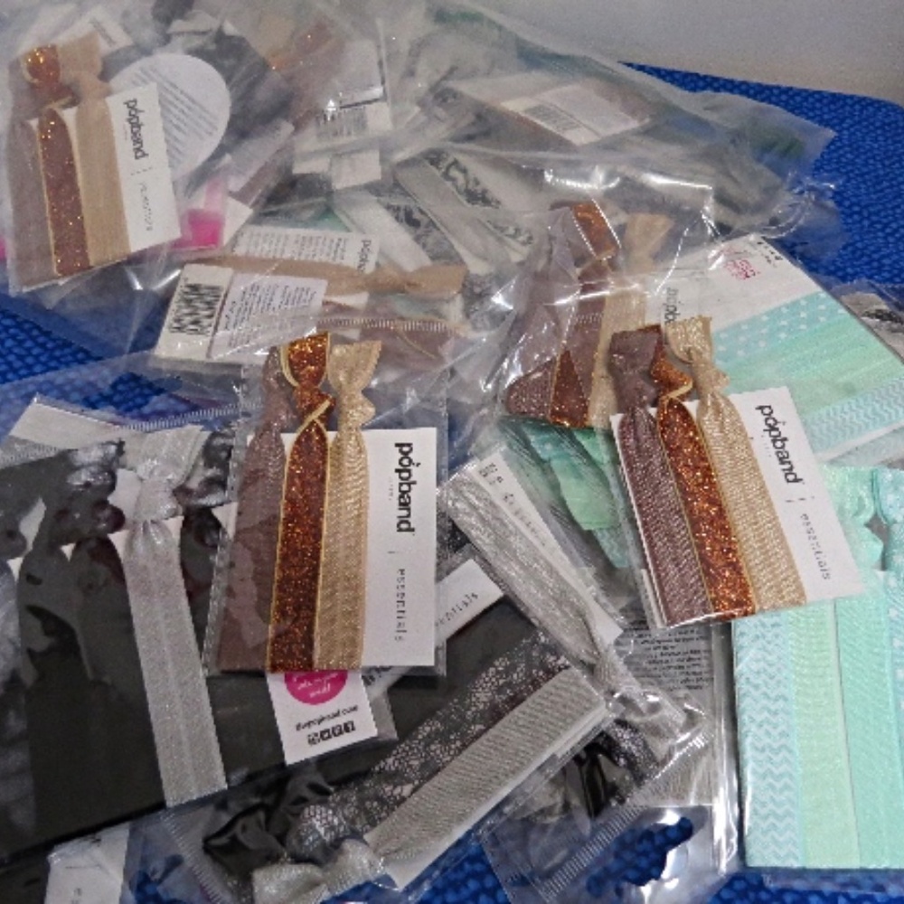 Approx. 40 New Packages of Popbands for your Hair Over 100 bands